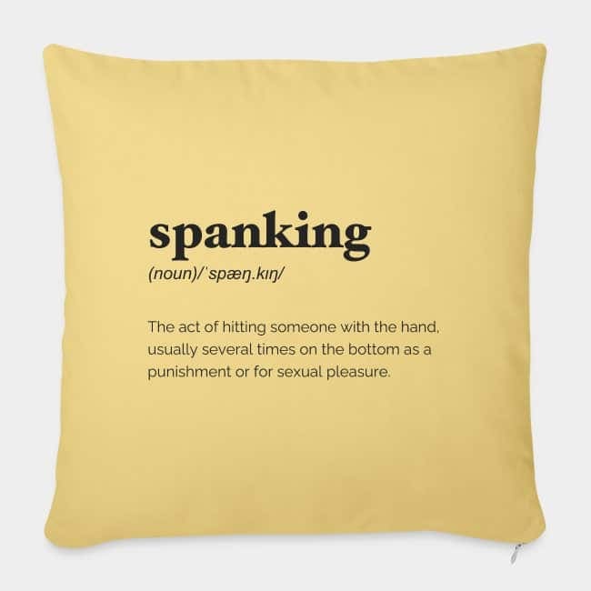 Yellow cushion printed with the dictionary definition of “spanking”