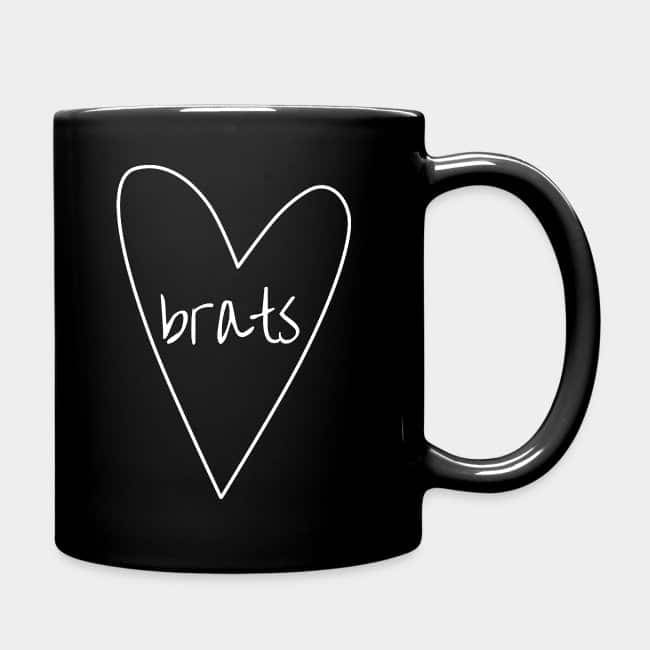 Black mug with a hand-drawn heart and the word “brats” in white
