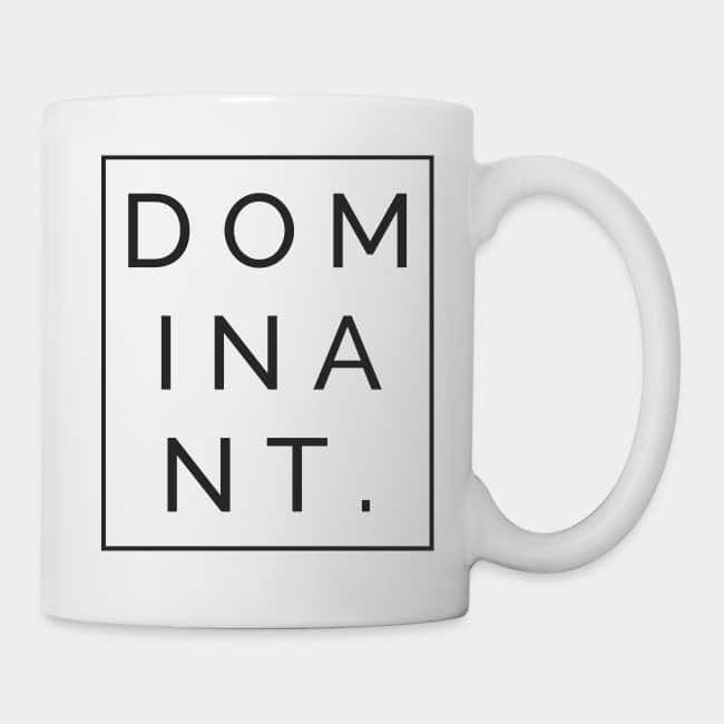 White mug with the word “DOMINANT.” inside a black frame