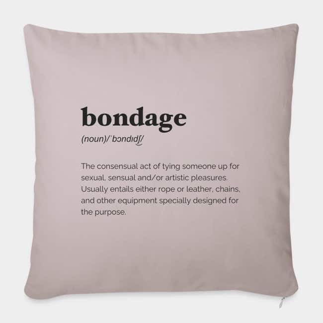 Dusty pink cushion printed with the dictionary definition of “bondage”
